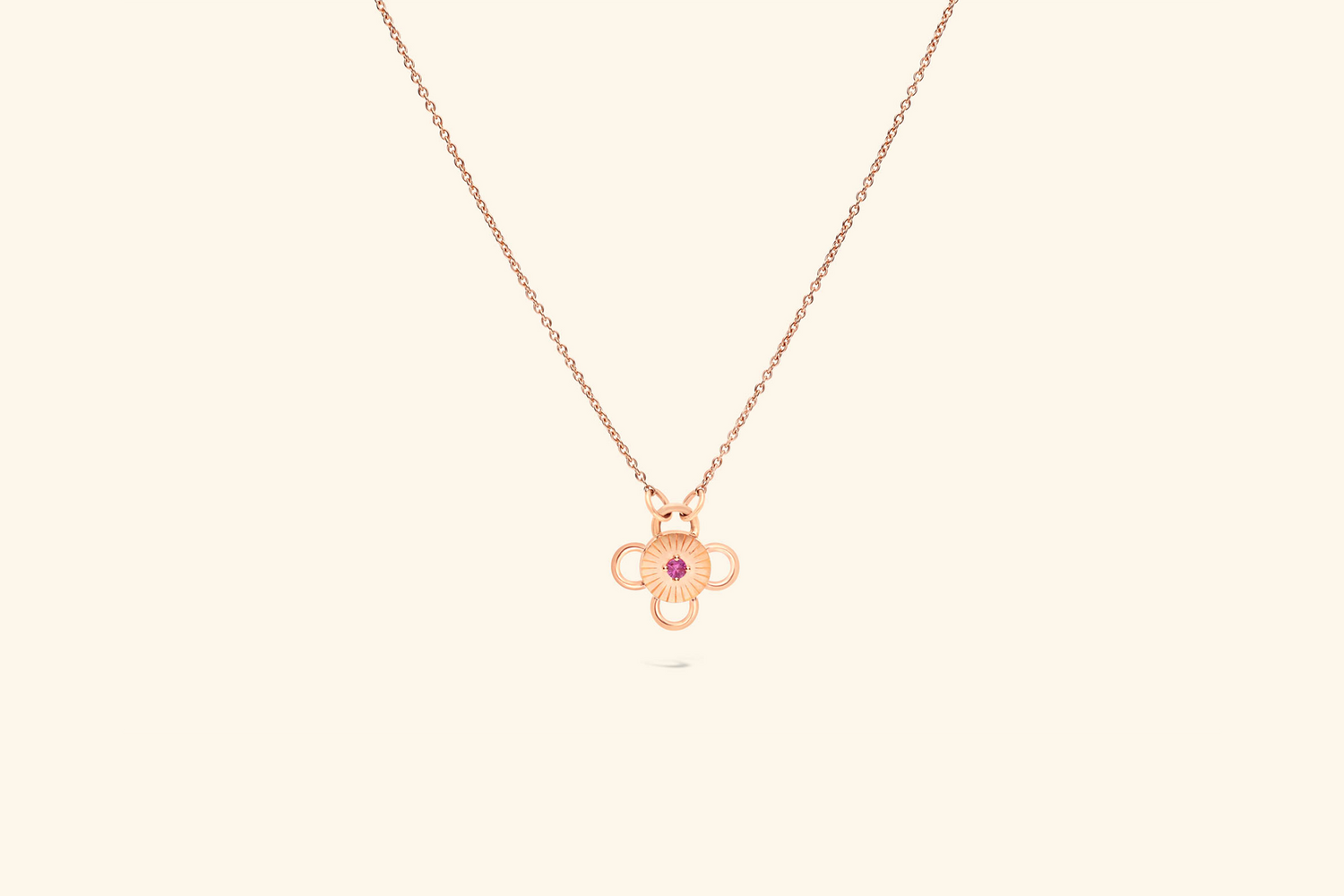 Collier Baby Bolt, saphir rose de ~0,07 carat serti sur un motif en or rose recyclé. 